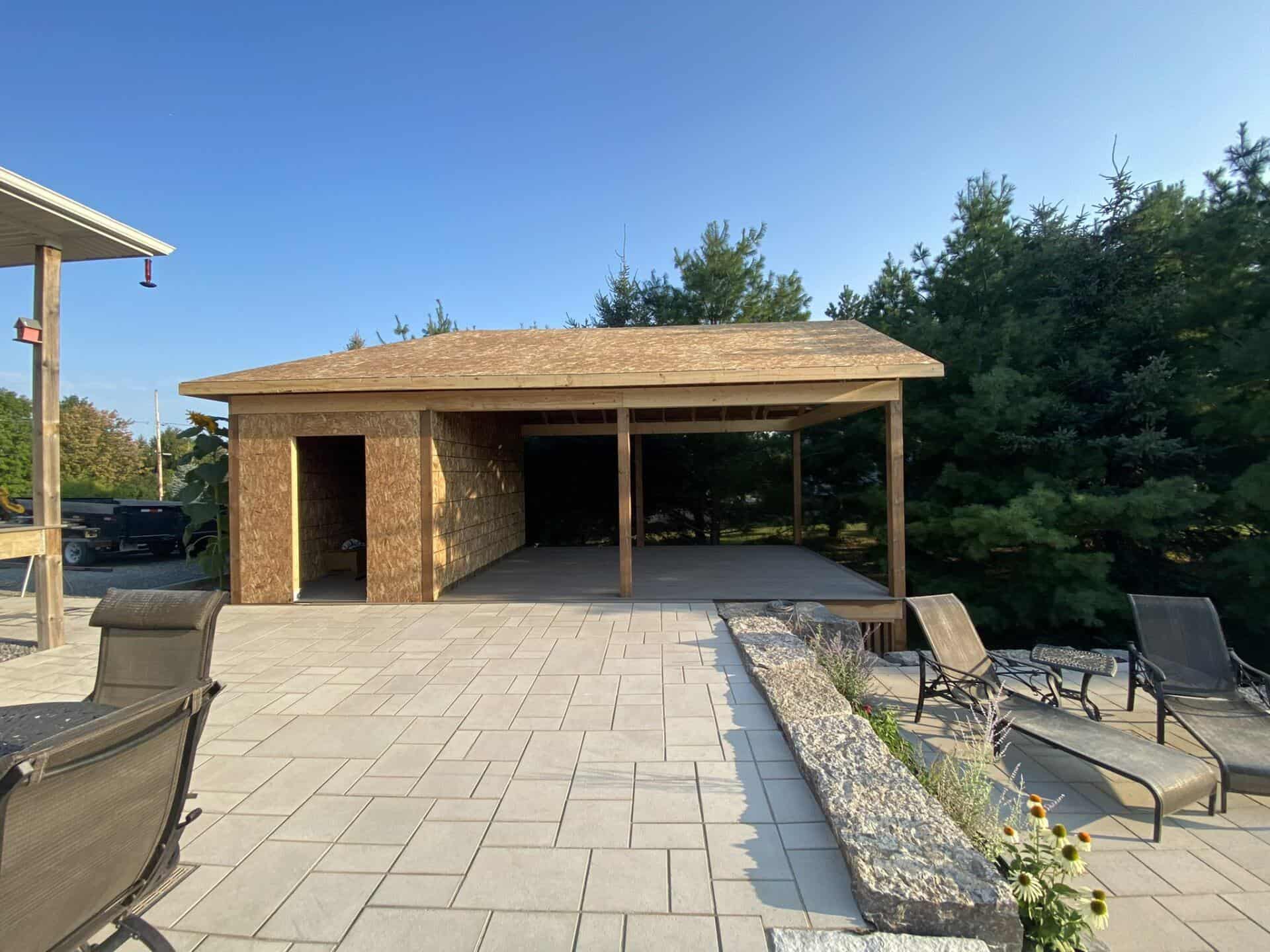 Custom garage building with deck, durable siding, and spacious patio – trusted renovation company in Ontario.