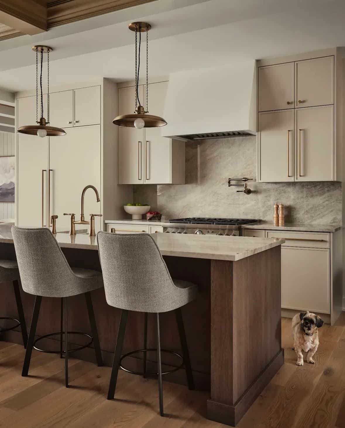 Bright kitchen with contemporary beige cabinets and elegant marble countertops, perfect for cooking and entertaining.